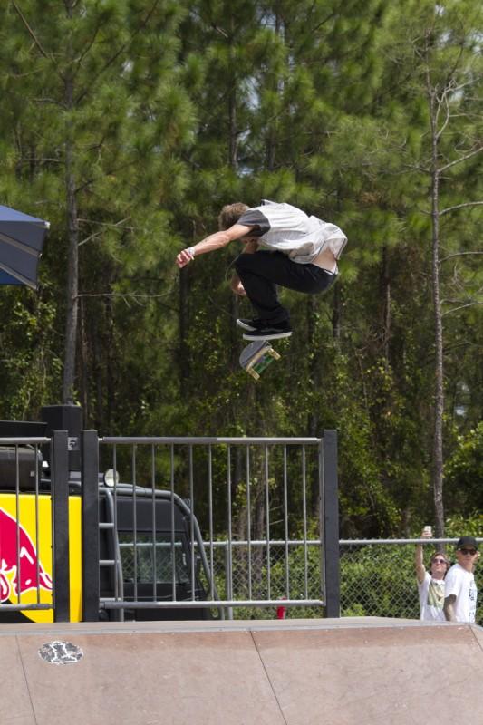 Ethan Sullivan does a kick flip over the railing. Photo by Randy Rataj