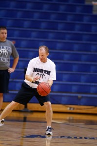 Coach Driscoll demonstrates proper dribbling form.
