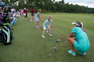 Thompson supervises up and coming golfers as they practice their swing. Photo by Camille Shaw
