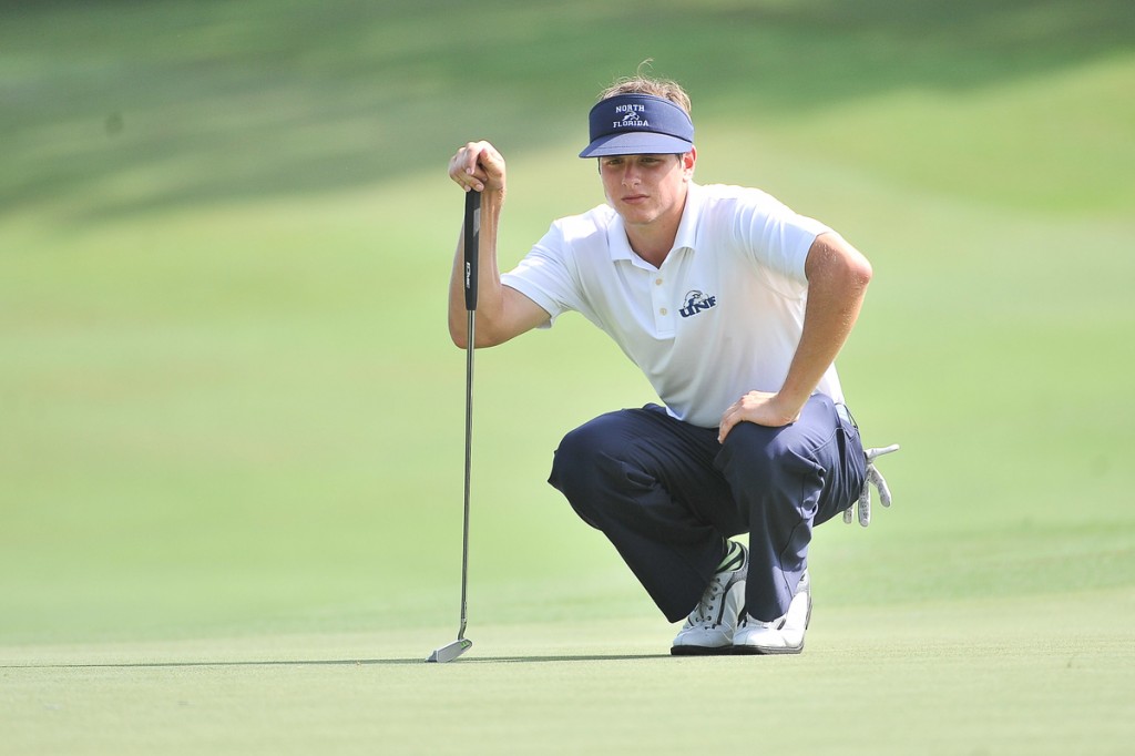 UNF’S Joey Petronio concentrates on the line of the putt. Photo by Chuck White