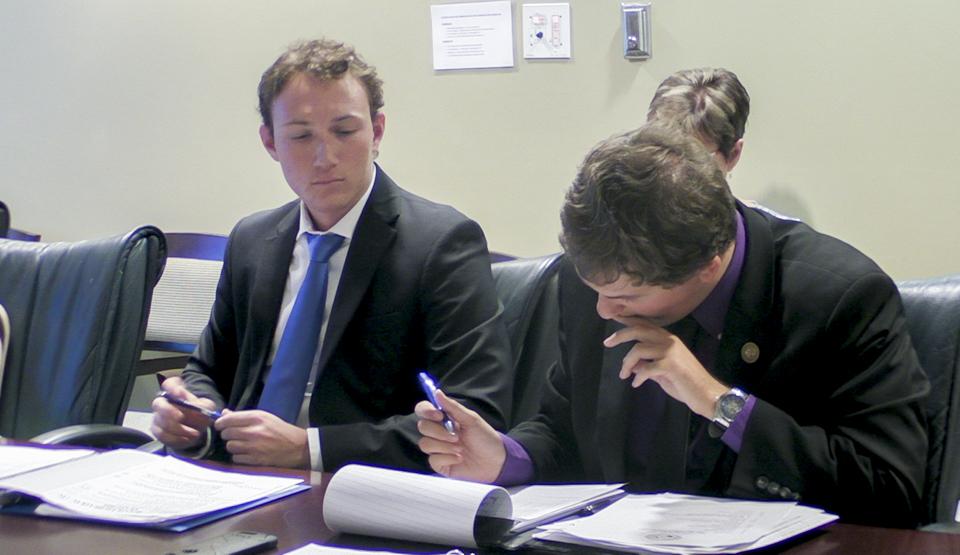 USAC members Austin Daniels (left) and Christopher Jordan (right) review a bill for approval.Photo by Christian Ayers