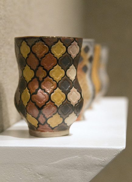 Abdulhalim’s creation “Cups” was made from a lengthy and unorthodox process. After creating the forms with clay, she made a plaster of them that she painted and baked onto the clay. After three more firings, glaze, and added copper, we have the final product. Photo by Rachel Cazares
