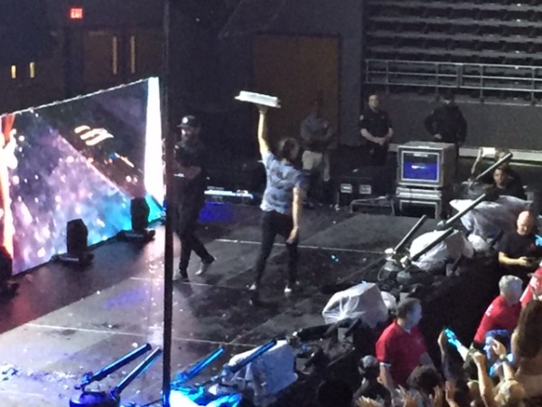 Aoki threw a total of nine cakes into the crowd for a sticky surprise. Photo by Rachel Cazares. 