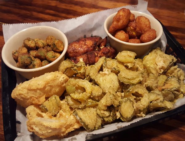 The appetizer sampler features portions of traditional southern food including fried okra and corn nuggets. Photo by Courtney Stringfellow. 