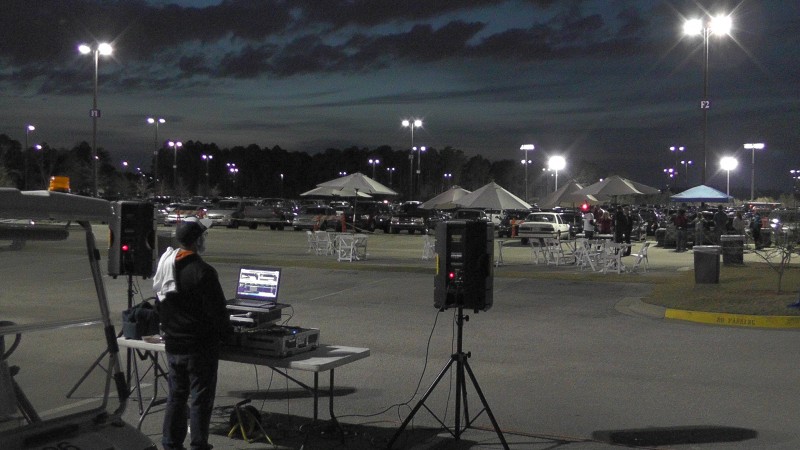 The last tailgate of the year with a few huddled students in the corner. Photo from video by Natalie Logan