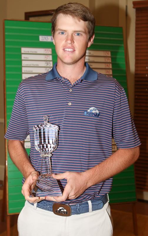 Photo Credit: Todd Drexler Senior Kevin Phelan holds the first place trophy after claiming the top spot at the John Hayt Collegiate Invitational