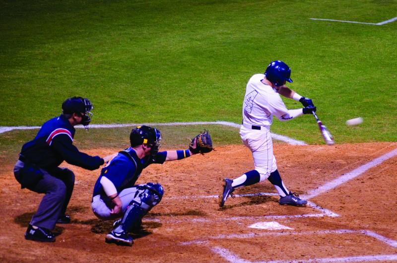 Photo Credit: Ali Blumenthal Kyle Brooks takes a swing in UNF's first series of the year against WVU