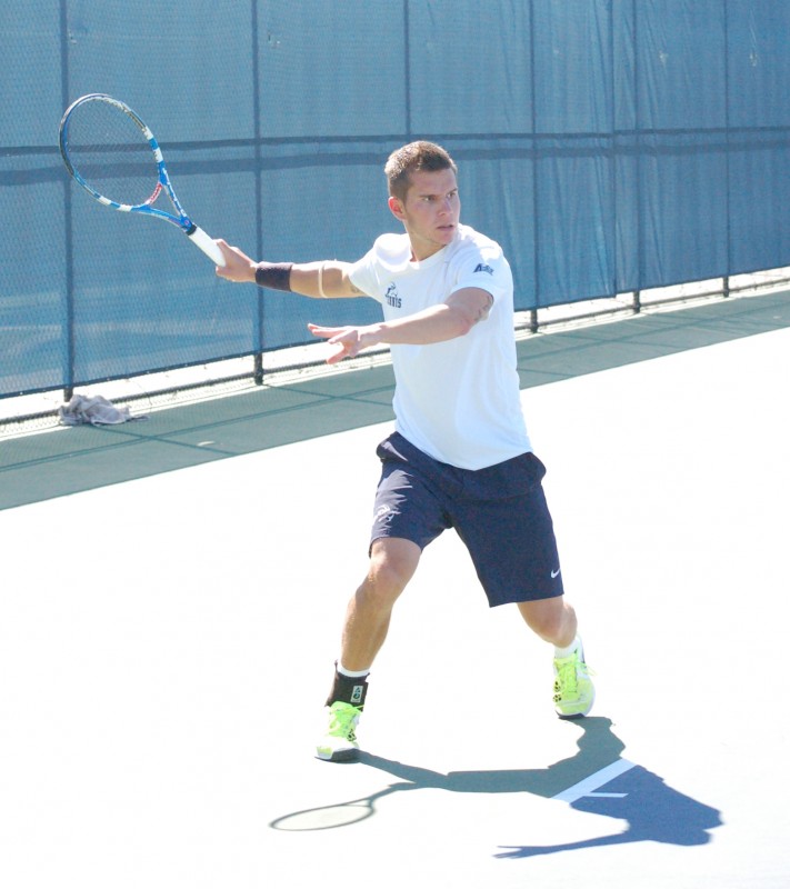 Photo Credit: Travis Gibson Sophomore Norbert Nemcsek lines up a shot against Mercer.