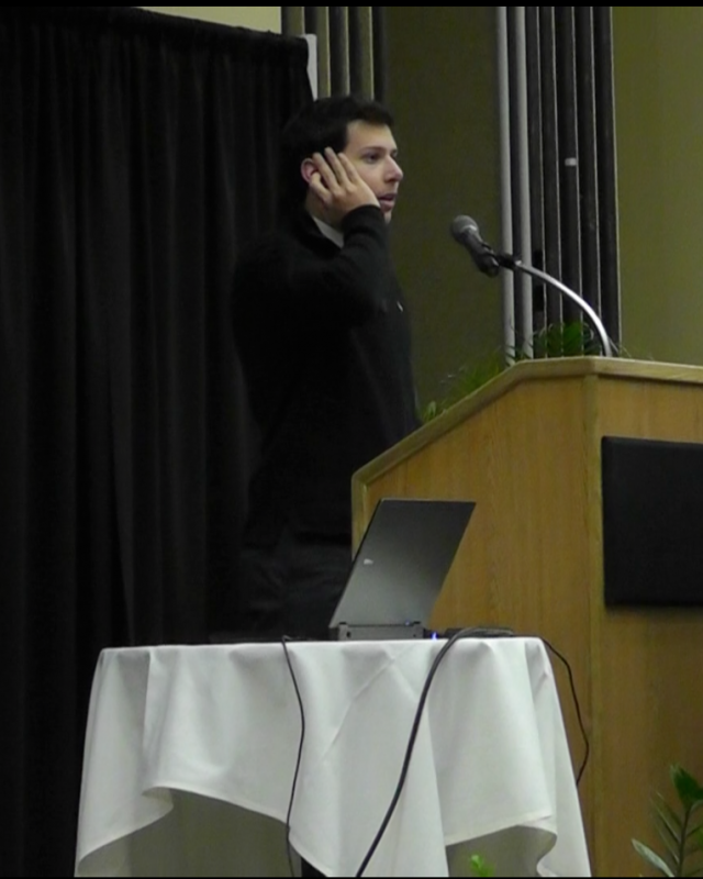 Pre-med freshman Omar Zeinlabdin gives an example of the Muslim Call to Prayer at the lecture March 2.
