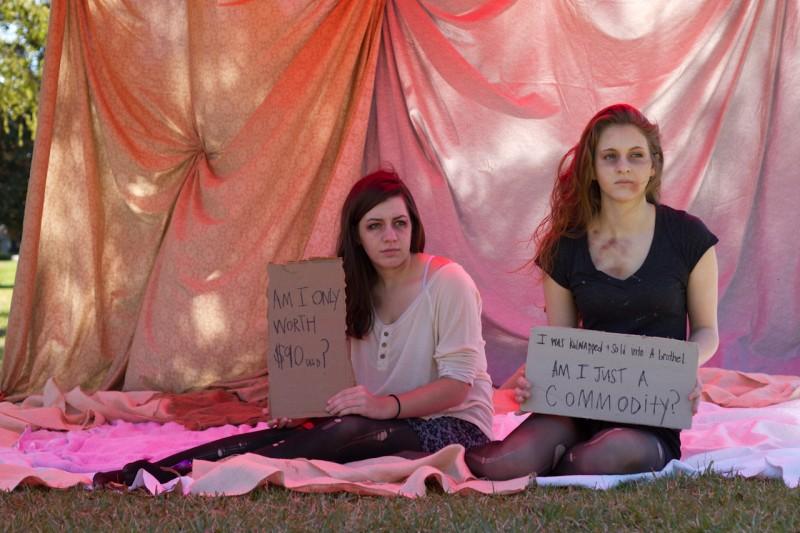 Left to right: Britte Stennes and Shayla Kilgannon participate in the mock brothel March 5.