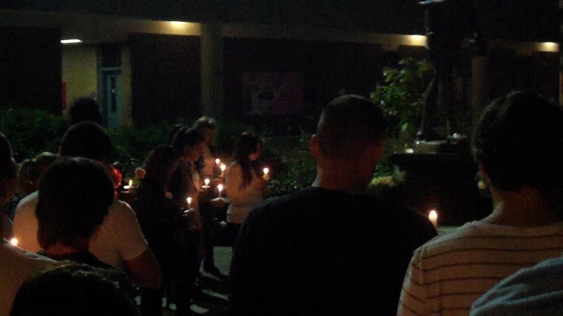 Students held candles and flowers in memory of Myriam Lahcen. Photo by Alex Wilson