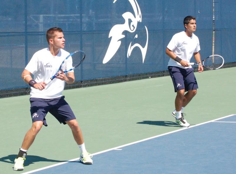 Photo Credit: Travis Gibson Sophomore Norbert Nemcsek (left) and Senior Daniel Sotomarino, pictured in a match against Mercer, are from Hungary and Peru, respectively. 