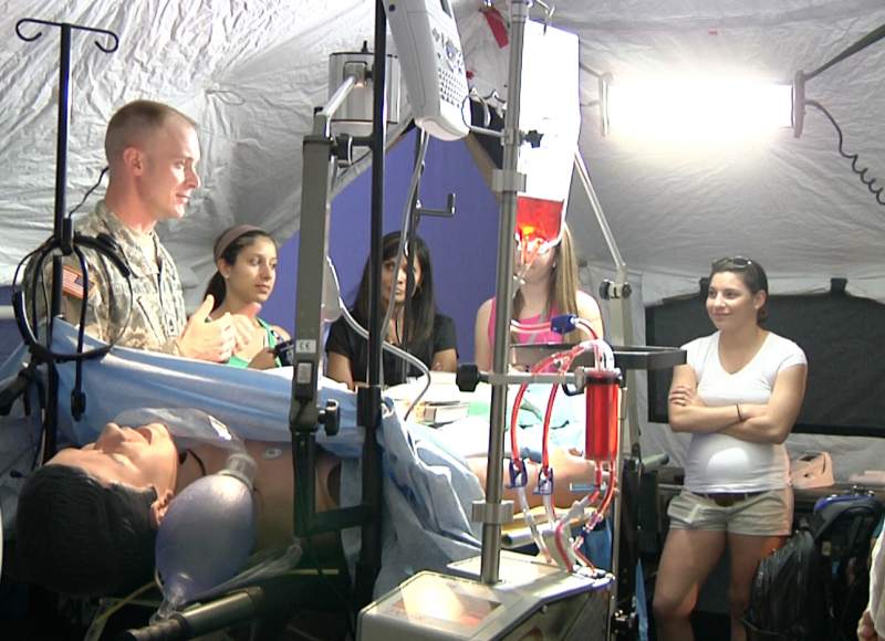 Sgt. Baer explains how medical treatment is done in the field.