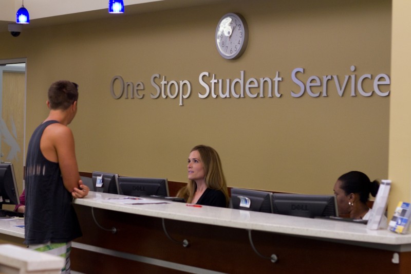 UNF students turn in documentation required to complete a FAFSA at the One Stop Student Services office in Hicks Hall.  Photo by Randy Rataj. 