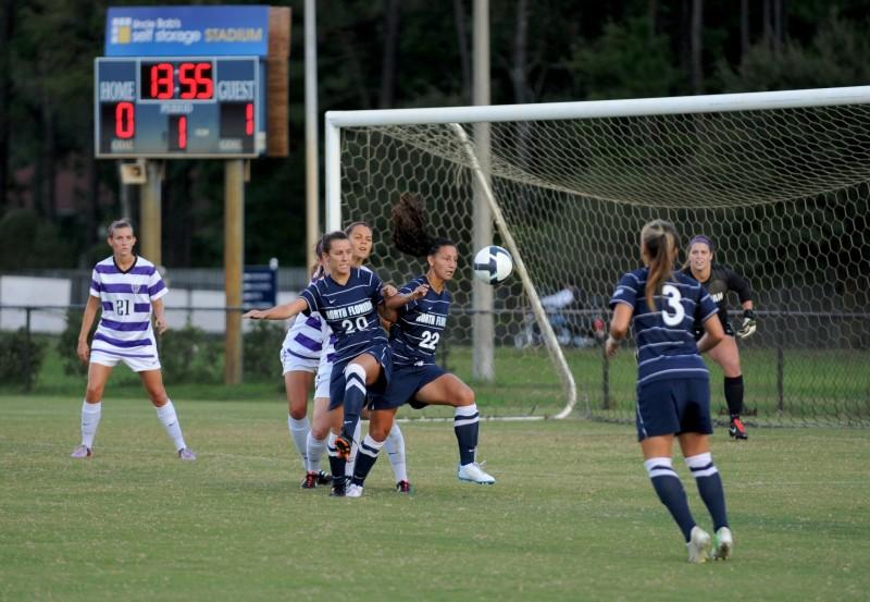 Carolina Lencina [22] and Heather Botelho [20] fight for a ball close to the Furman goal. 