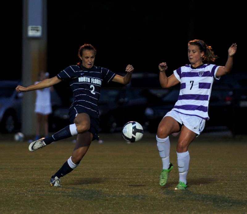 Thea Linkfield goes for a 50/50 ball in a Friday night loss Furman. Linkfield rebounded on Sunday with a goal and a UNF win. (Photo credit: John Shippee)