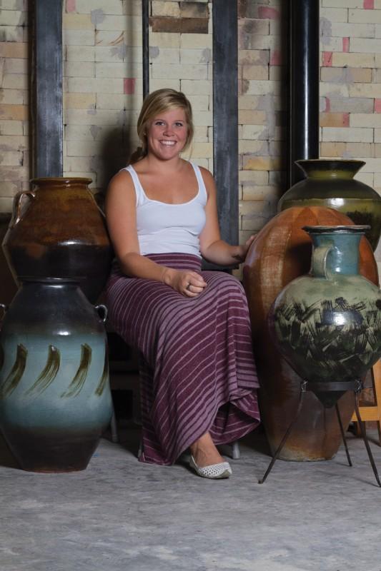 Logan Wall, a fine arts junior, creates pottery as part of a concentration in ceramics. Photo by Randy Rataj