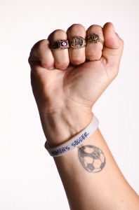 Linda Hamilton displays her championship rings. Photo by Ali Blumenthal