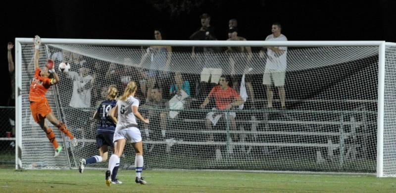 A brilliant shot from JU's Jessica Cataldo-Ramirez flies past the outstretched hand of UNF keeper Megan Dorsey. (Photo credit: John Shippee)