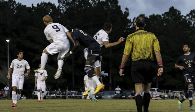 Jay Bolt and Pedro Carneiro collide with an ETSU player during their Oct. 4 match. Soccer can be a dangerous sport. Photo by Garrett Haupt