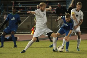 Forward Casey Caronis battles an FGCU defender earlier this season. 