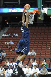 Charles McRoy slams one for 2 of his 10 points on the night. Photo Credit: John Shippee