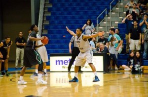 Travis Wallace with arms spread on defense. The team will need to step up defensively Saturday against ETSU. Photo by Robert Curtis 