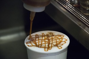 A sweet Caramel Macchiato being topped with rich caramel at the Starbucks on UNF's campus. Photo by Bronwyn Knight.
