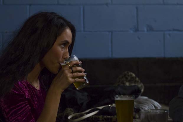 Amelia Gabrielle, psychology junior, sips from her beer at Green Room. Photo by Randy Rataj.