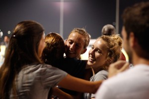 Friends and teammates congratulate Elle Baker on her 10th place finish. Photo by Joshua Brangenberg. 