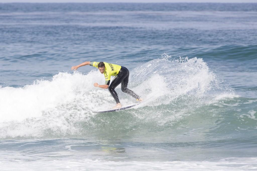 Adam Batroshesky with a back side snap during his first heat, "Barto" was the first surfer in the water from UNF and started the day out strong advancing into the next round. Photo by Randy Rataj