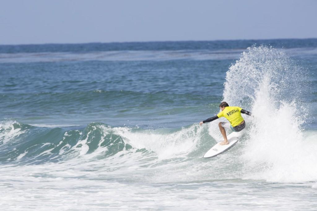 Jake Compton got a few good waves during his heat, throwing buckets of water in this front side snap. Photo by Randy Rataj