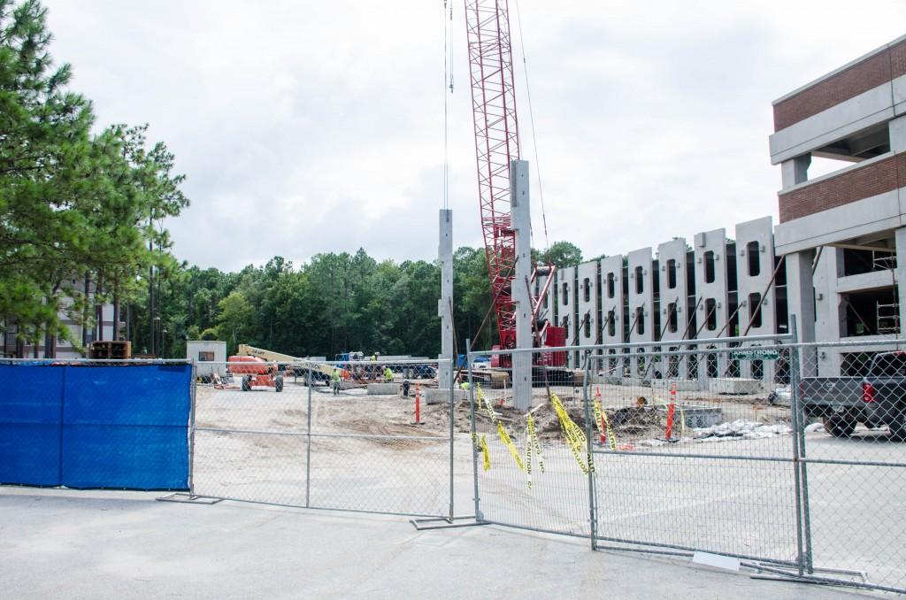 The new parking garage is being built right behind the villages.  Photo by Robert Curtis 