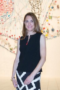 Caroline Lathan-Stiefel stands in front of her exhibit.  Photo by 