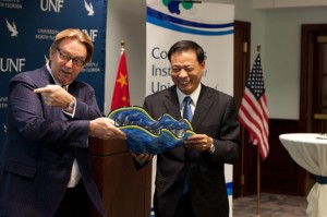 Delaney gave Zhang a blown glass bowl from St. Augustine to commemorate this agreement. Photo by Joshua Brangenberg