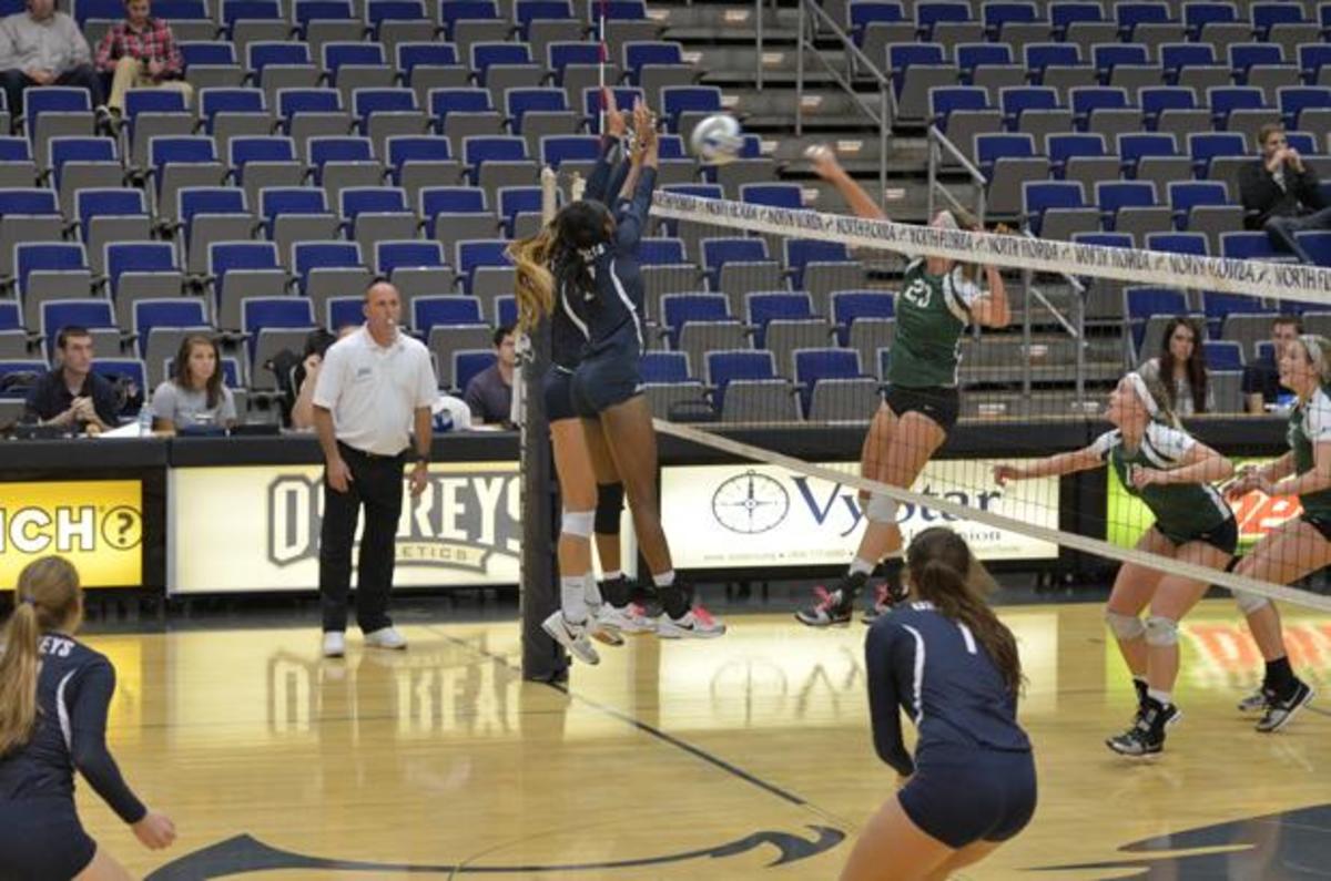 Erin Edwards (2) aids in blocking a shot from Stetson