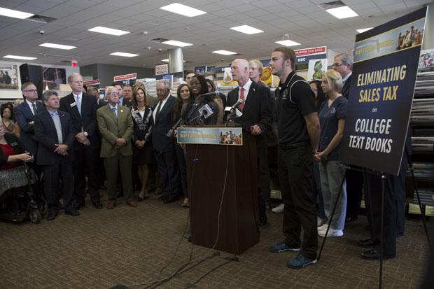 Students and staff gathered around Scott to hear about his plan to alleviate student costs.Photo by Camille Shaw