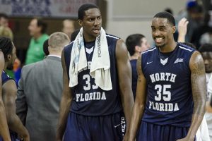 Romelo Banks (33) and Chris Davenport (35) talk after their victory against FGCU. Photo courtesy Tessa Mortensen / Eagle News  