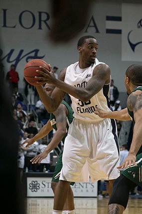 Earlier this season, Chris Davenport (35) holds the ball against JU defense on Feb. 6.
Photo by Camille Shaw