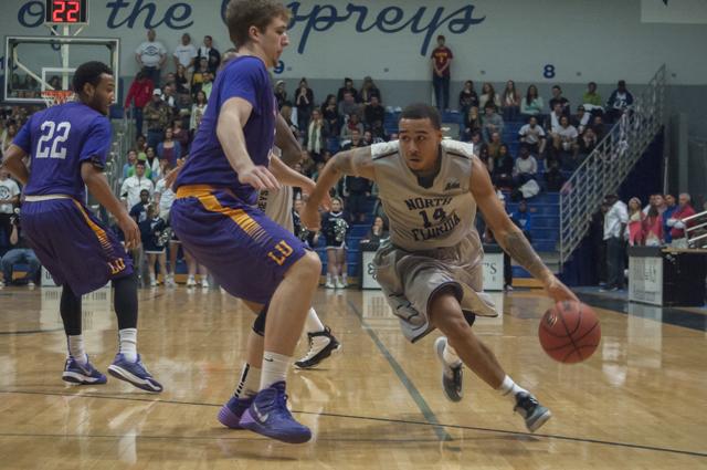 Dallas Moore (14) makes his way around Lipscomb defense.
Photo by Morgan Purvis