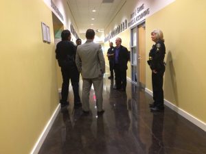 Thornton speaks with UNFPD officers and Baker outside the Senate ChambersPhoto by Patrick Lloyd