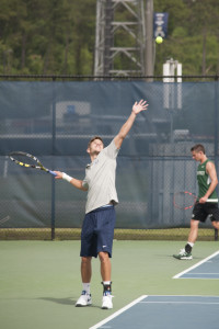 Norbert Nemcsek serves during the game against Stetson Thursday.  Photo by Morgan Purvis