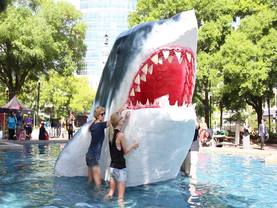 UNF shark sculpture lurks in the water at Hemming Park