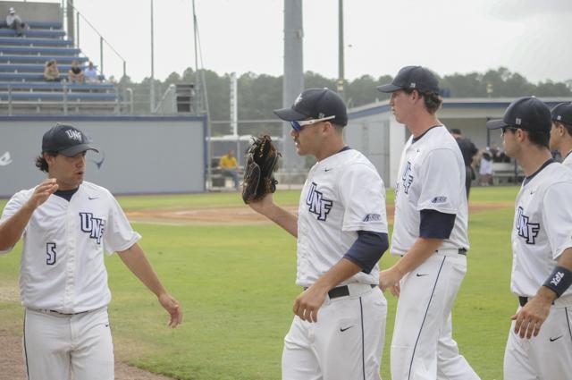 The team gets high fives as they come in from an inning.Photo by Morgan Purvis