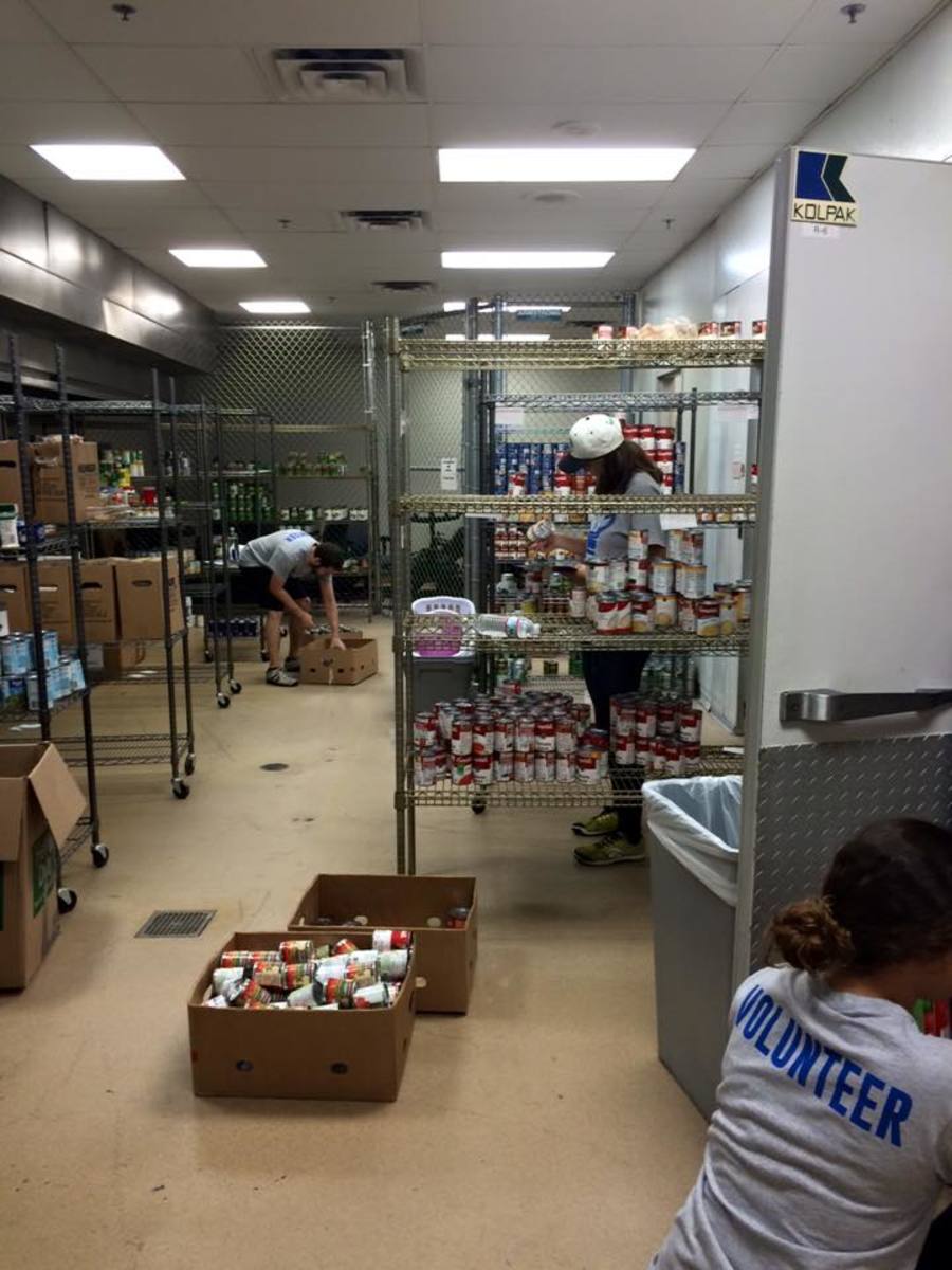 Volunteers sort through donations to stock the pantry shelves.Photo courtesy Facebook