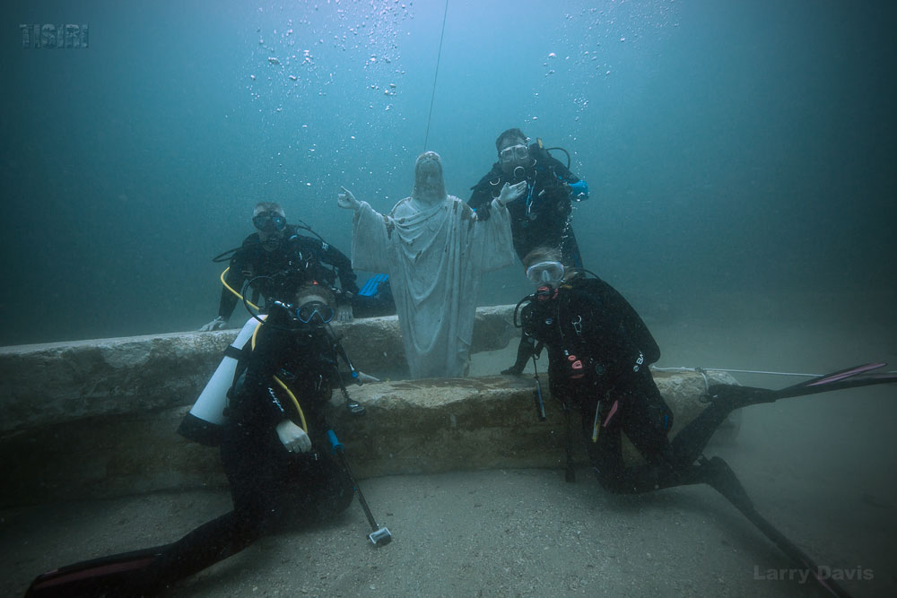 Ed Dendor, Jack Leone, Emily Leone, and Elizabeth Leone with the memorial Jesus statue. Photo courtesy TISIRI.org