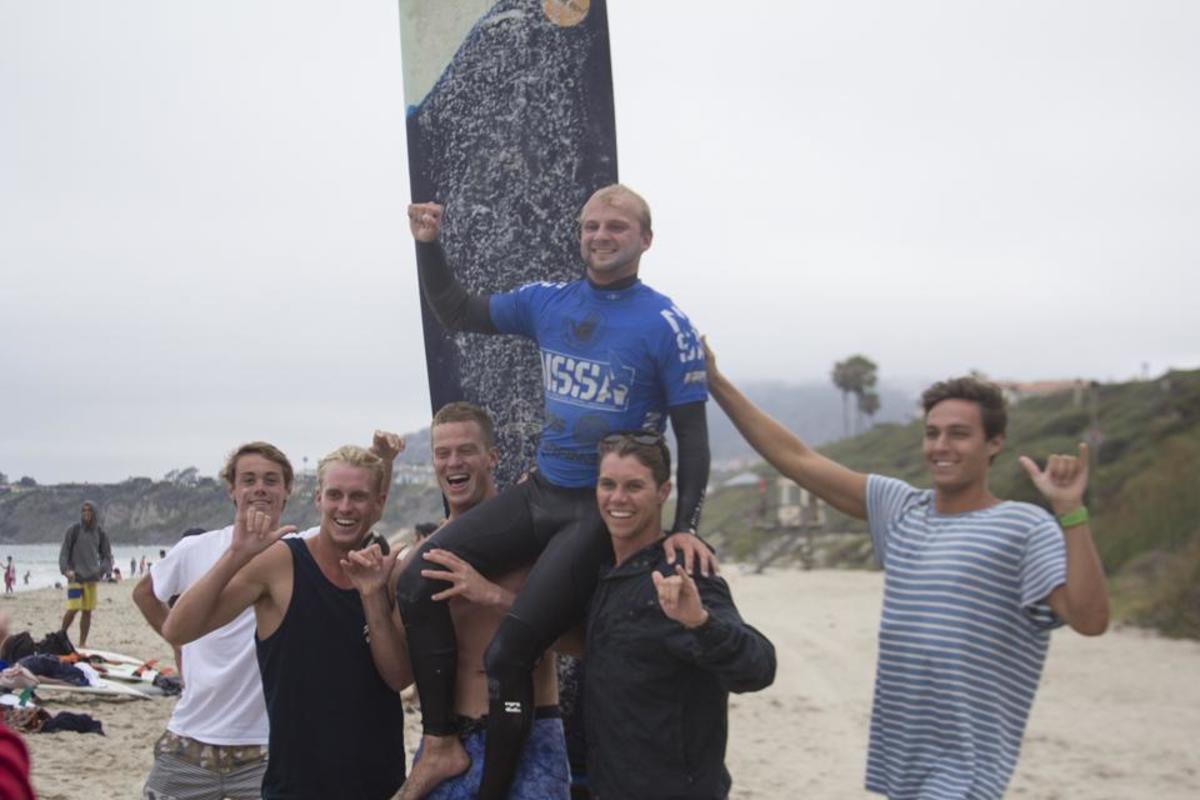 Some UNF Surf team members hoist up Pat Nichols, Longboarding National Champion.Photo by Raymond Bunch