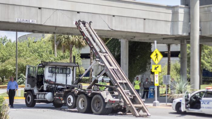 The driver of the Waste Management truck failed to lower the bed of the truck after a delivery. Photo by Michael Herrera