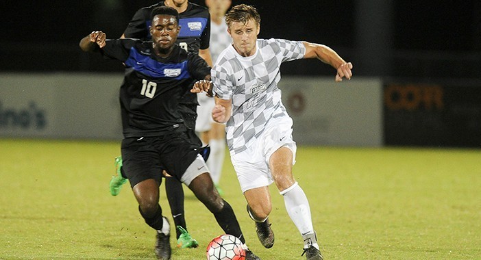 GSU forward Rashid Alarape jostles for position with UNF defender Sylwester Szczesniewicz.

 Photo courtesy UNF Athletics 