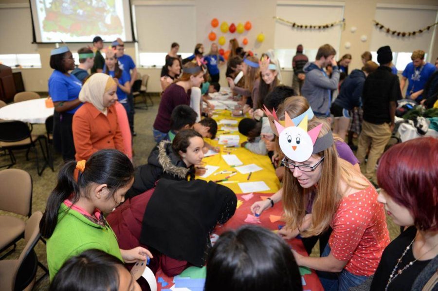 Honors students host an event for local refugees to help them learn about American traditions like Thanksgiving. Each year the Honors Program works with refugees in numerous ways as part of a semester-long service project. 
Photo courtesy Dr. Leslie Kaplan, Honors Program